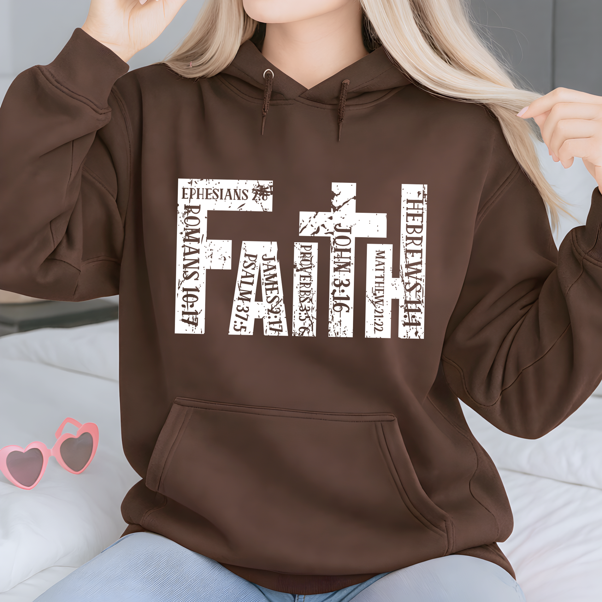 Woman wearing Brown unisex Christian hoodie with distressed faith cross graphic
