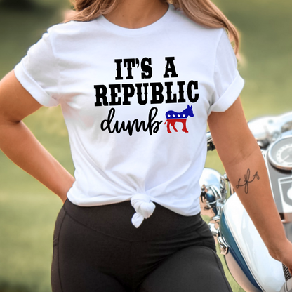 Person wearing a white t-shirt with political text and symbols, standing next to a motorcycle.
