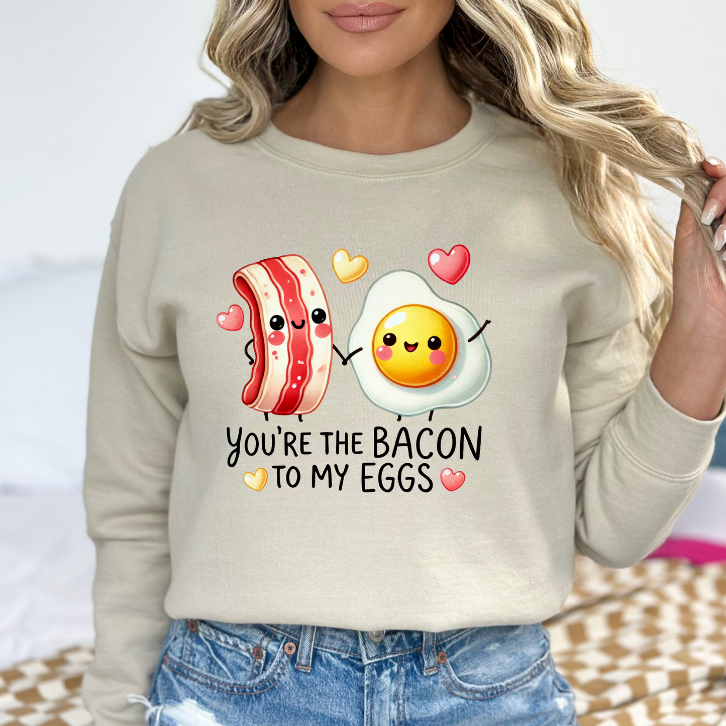 Sand-colored sweatshirt with playful bacon and egg graphic for women