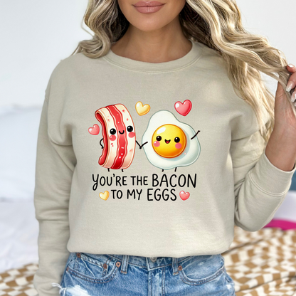 Sand-colored sweatshirt with playful bacon and egg graphic for women