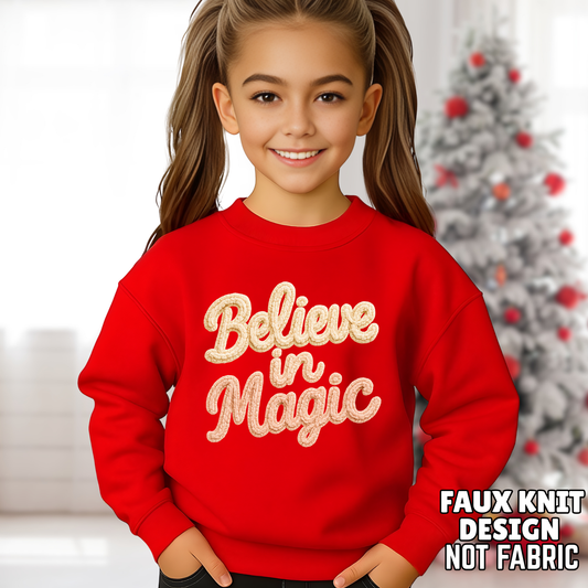 Youth girl wearing red Believe in Magic faux knit printed Christmas sweatshirt