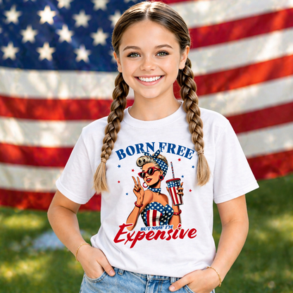 Young girl wearing a funny patriotic t-shirt with a graphic design in front of an American flag