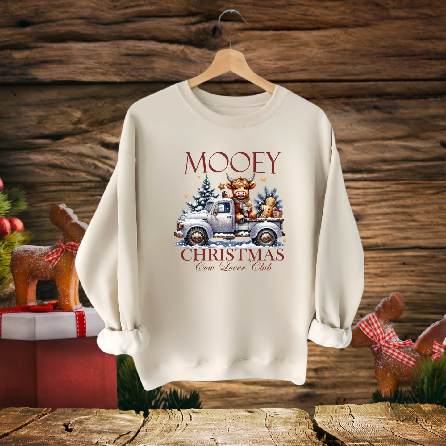 Light Sand sweatshirt with “Mooey Christmas Cow Lover Club” graphic

