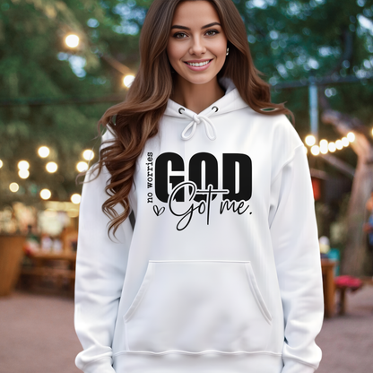 Woman wearing a white Christan shirt with text "No Worries GOD Got me"