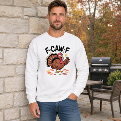 Man wearing a white crewneck sweatshirt with a colorful F-CAW-F turkey graphic in a fall patio setting.