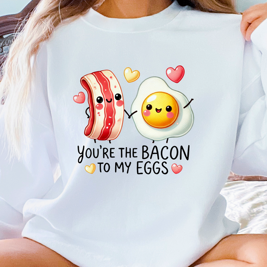 White crewneck sweatshirt with smiling breakfast food characters