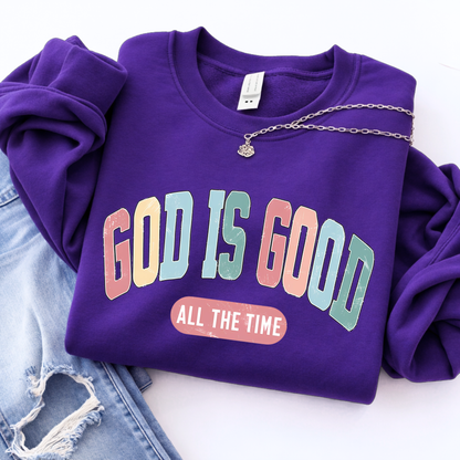 Purple sweatshirt with 'God is Good All the Time' text on a white background
