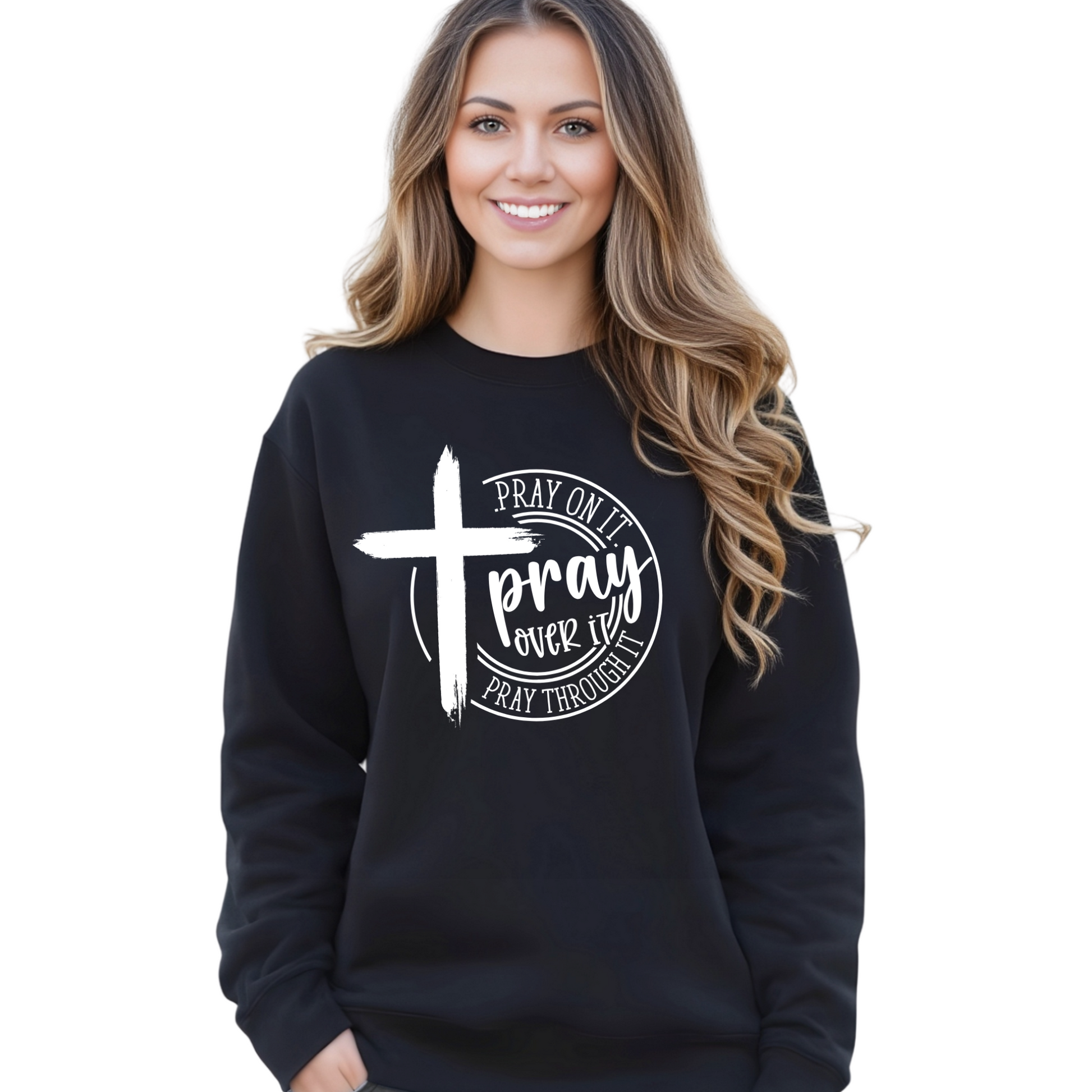 Woman wearing black Pray Over It Christian sweatshirt with faith cross graphic