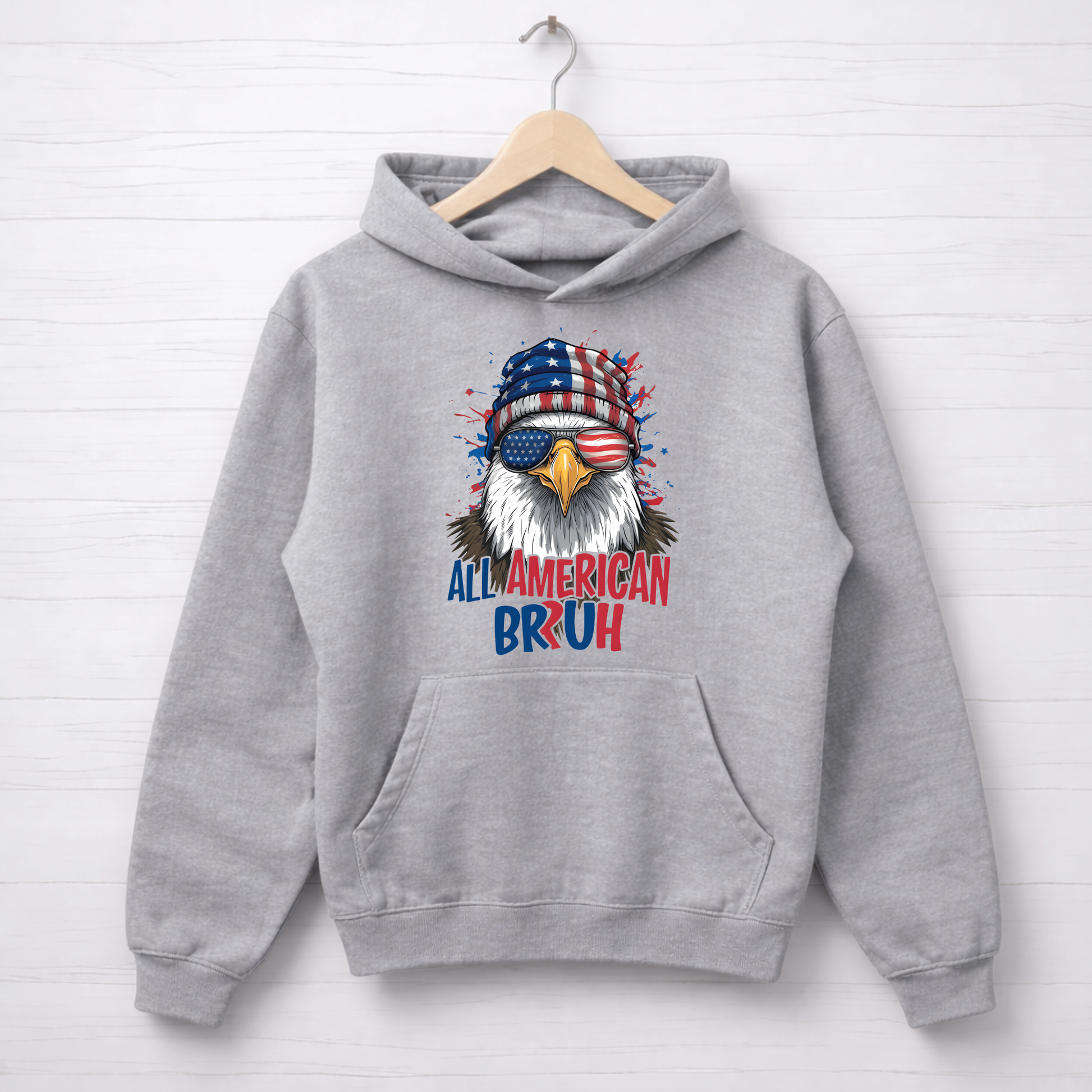 Gray hoodie with an eagle graphic and text on a white background