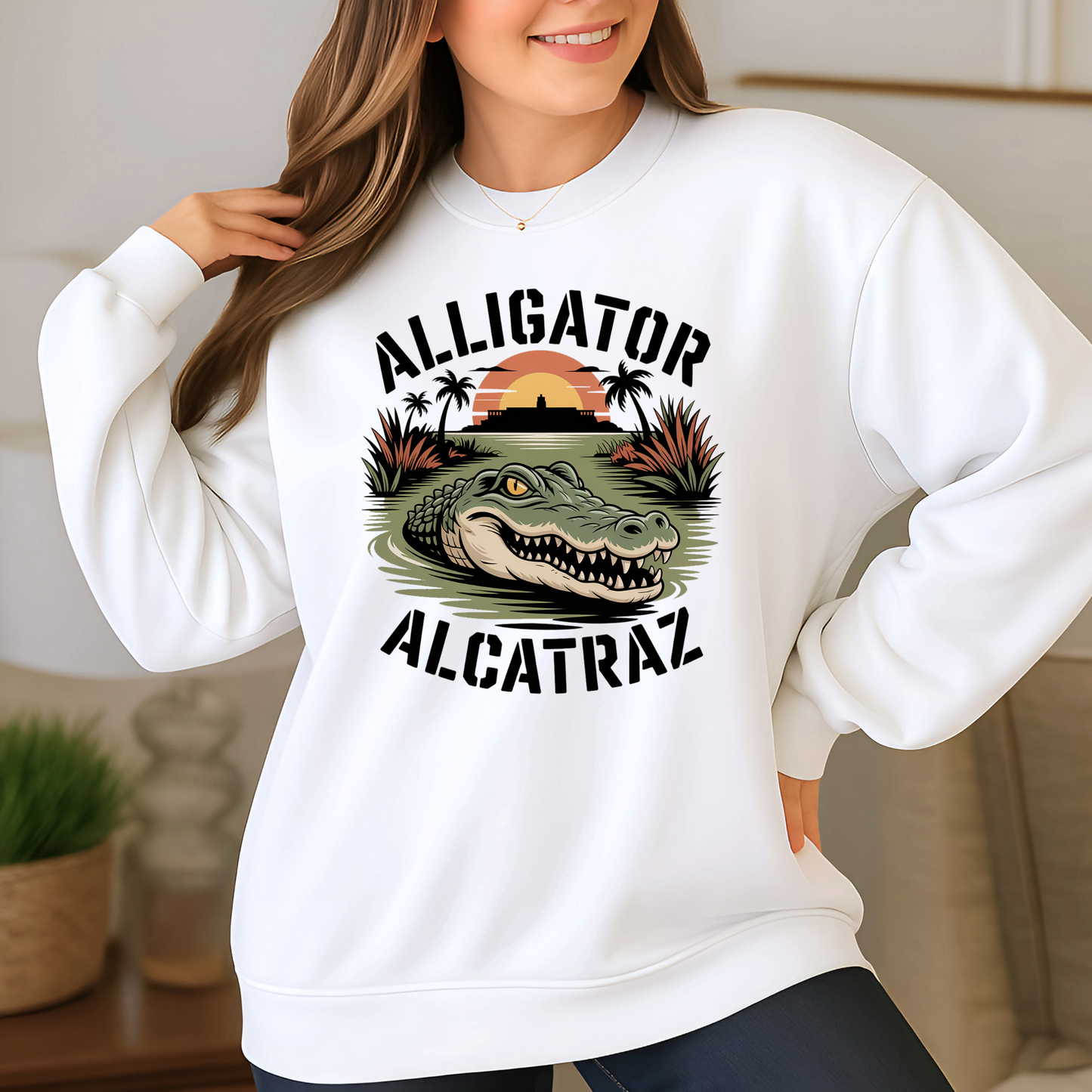 Person wearing a white sweatshirt with an alligator graphic and text in a home setting