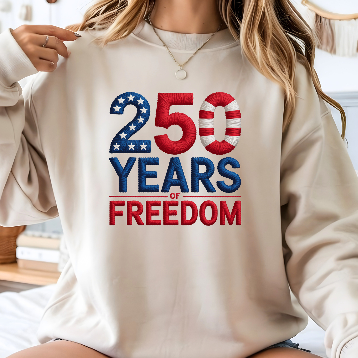 Beige sweatshirt with 250 Years of Freedom patriotic design worn by woman smiling