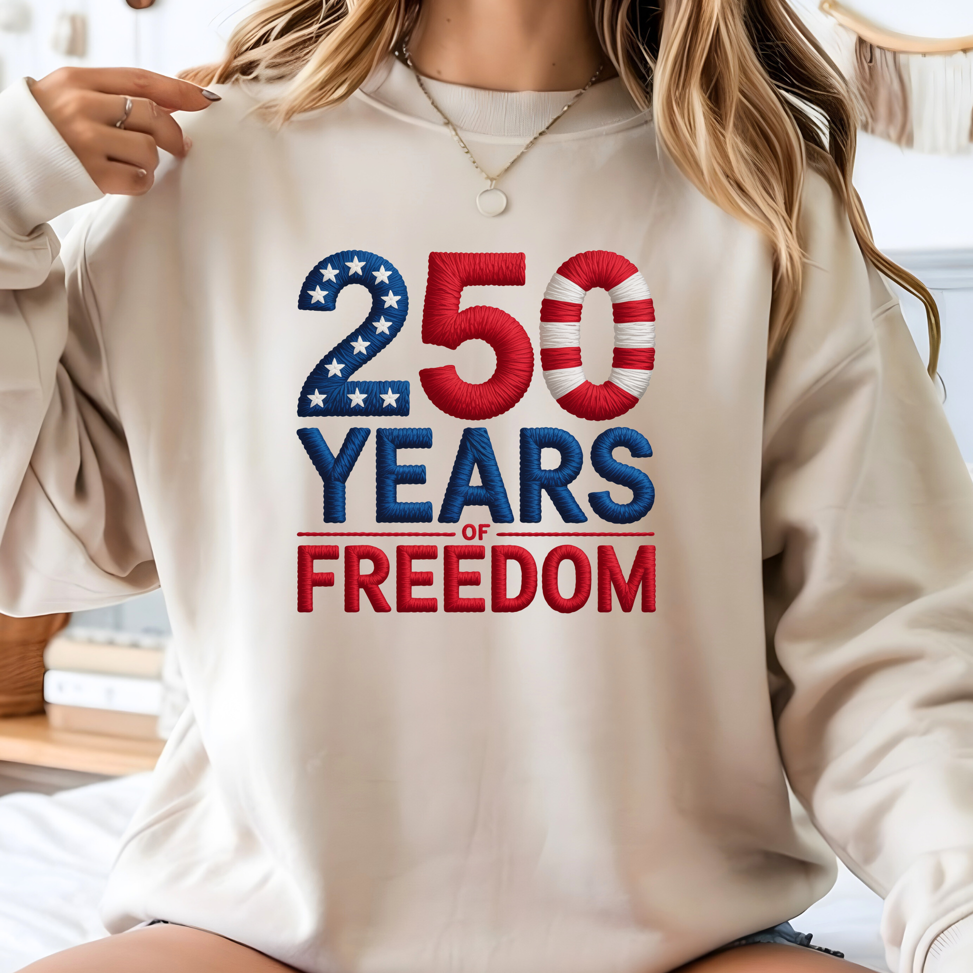 Beige sweatshirt with 250 Years of Freedom patriotic design worn by woman smiling