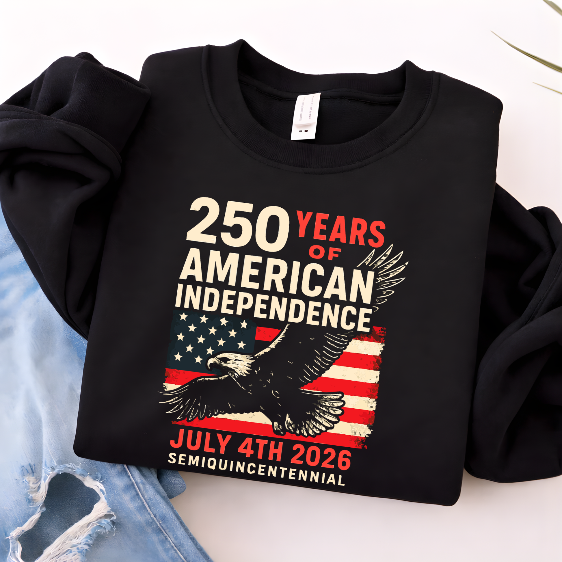 Black sweatshirt folded showing 250 Years of American Independence eagle and distressed American flag graphi