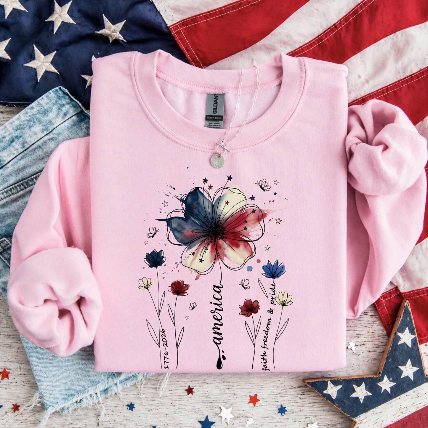 Light pink America 250 floral patriotic sweatshirt with watercolor flower graphic and Faith Family Freedom design