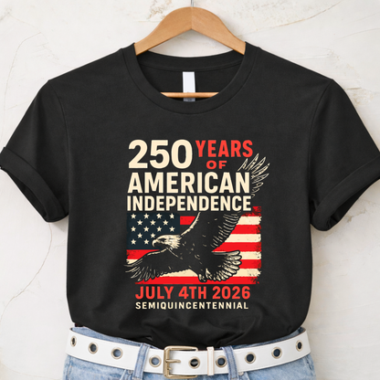 Black t-shirt with American Independence Day design featuring an eagle and flag, hanging on a wooden hanger.
