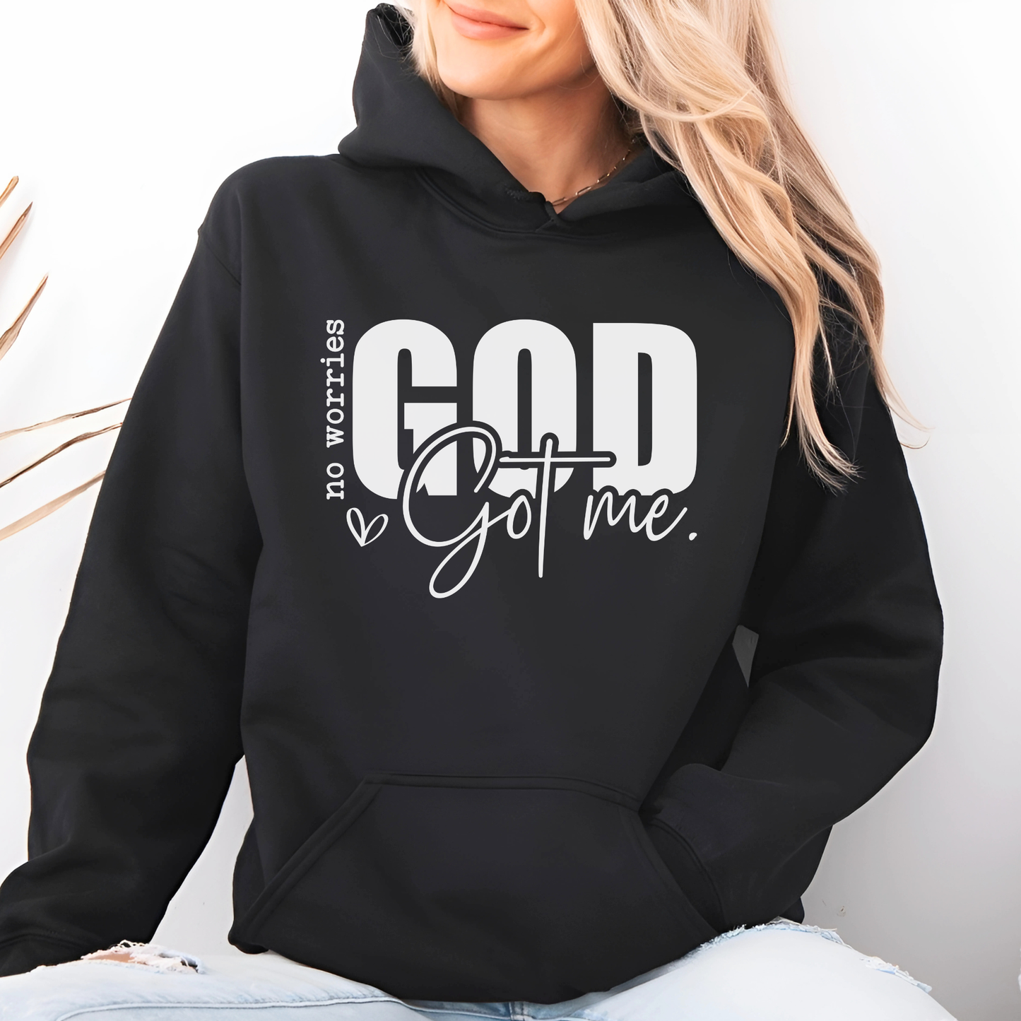 Woman wearing a Black Christan Hoodie with text "No Worries GOD Got me"