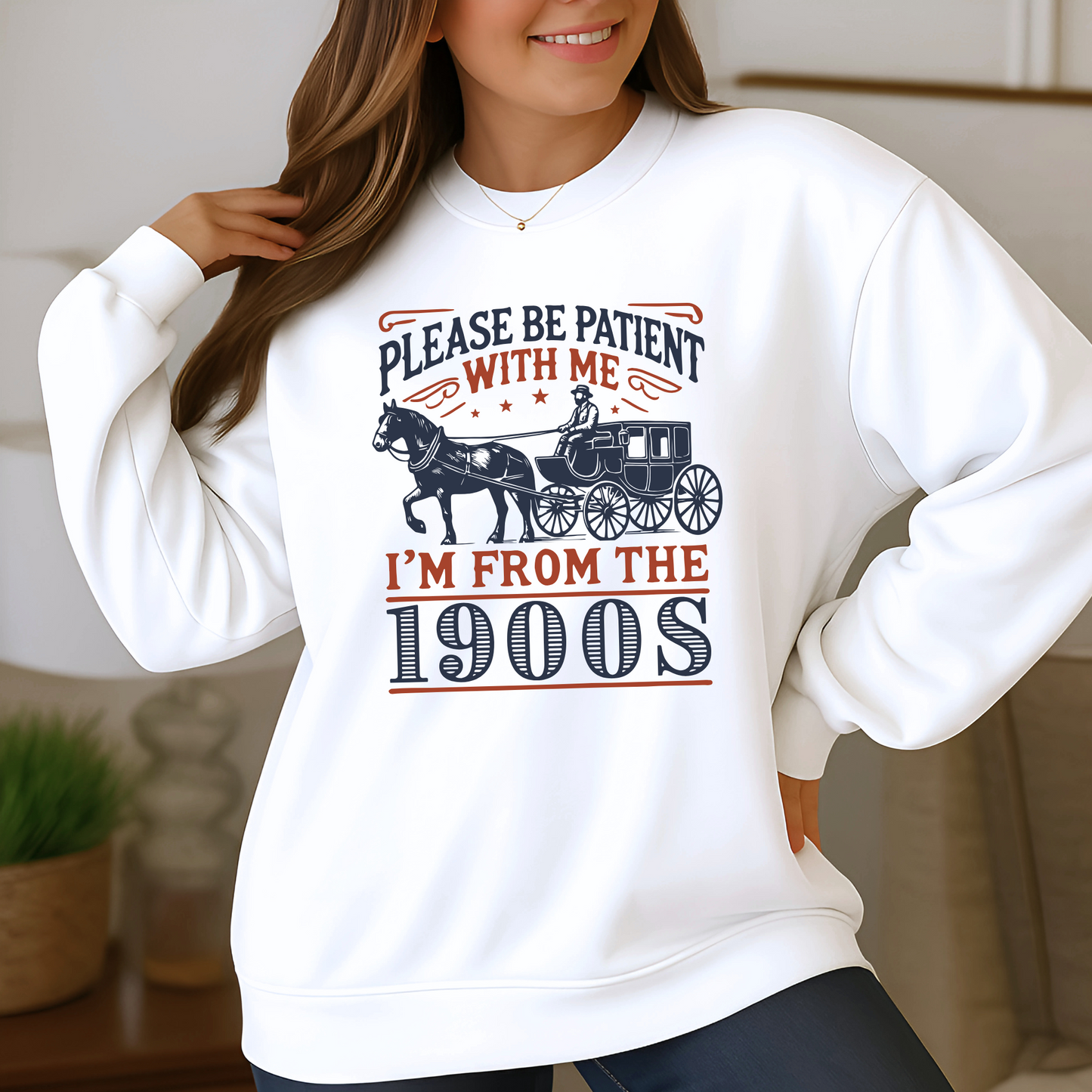 Model wearing white sweatshirt with funny vintage horse and carriage graphic that says Please Be Patient With Me I’m From the 1900s – cozy unisex crewneck for men and women