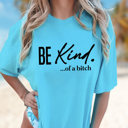 Beach-style baby blue shirt with “Be Kind…of a bitch” text worn over a swimsuit