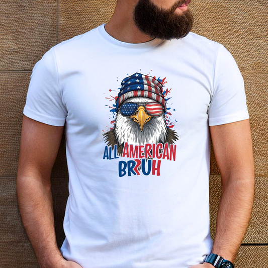 Bearded man in white “All American Bruh” T-shirt with patriotic eagle graphic. Urban street background enhances the bold red, white, and blue 4th of July design. Perfect for guys celebrating American pride, freedom, and military holidays like Independence Day or Memorial Day.

