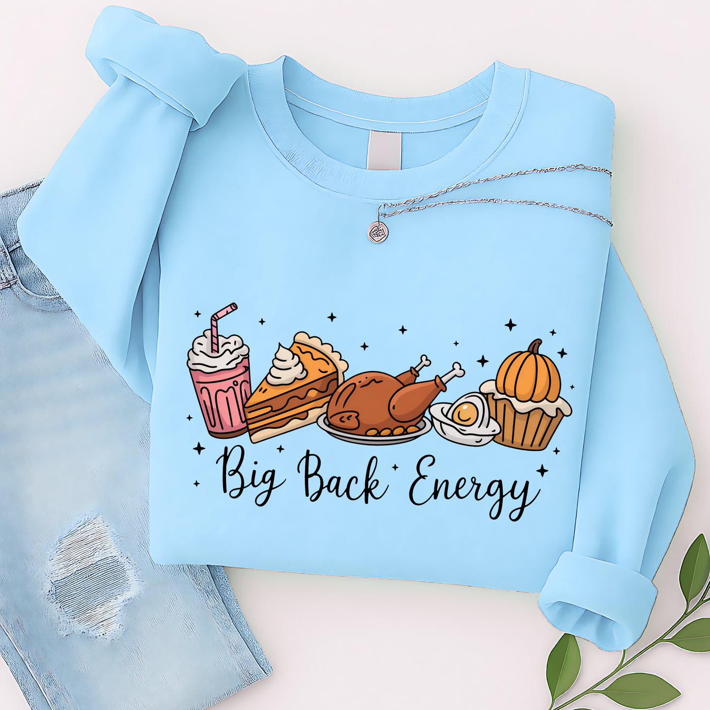 Light blue sweatshirt flat lay with Big Back Energy Thanksgiving print