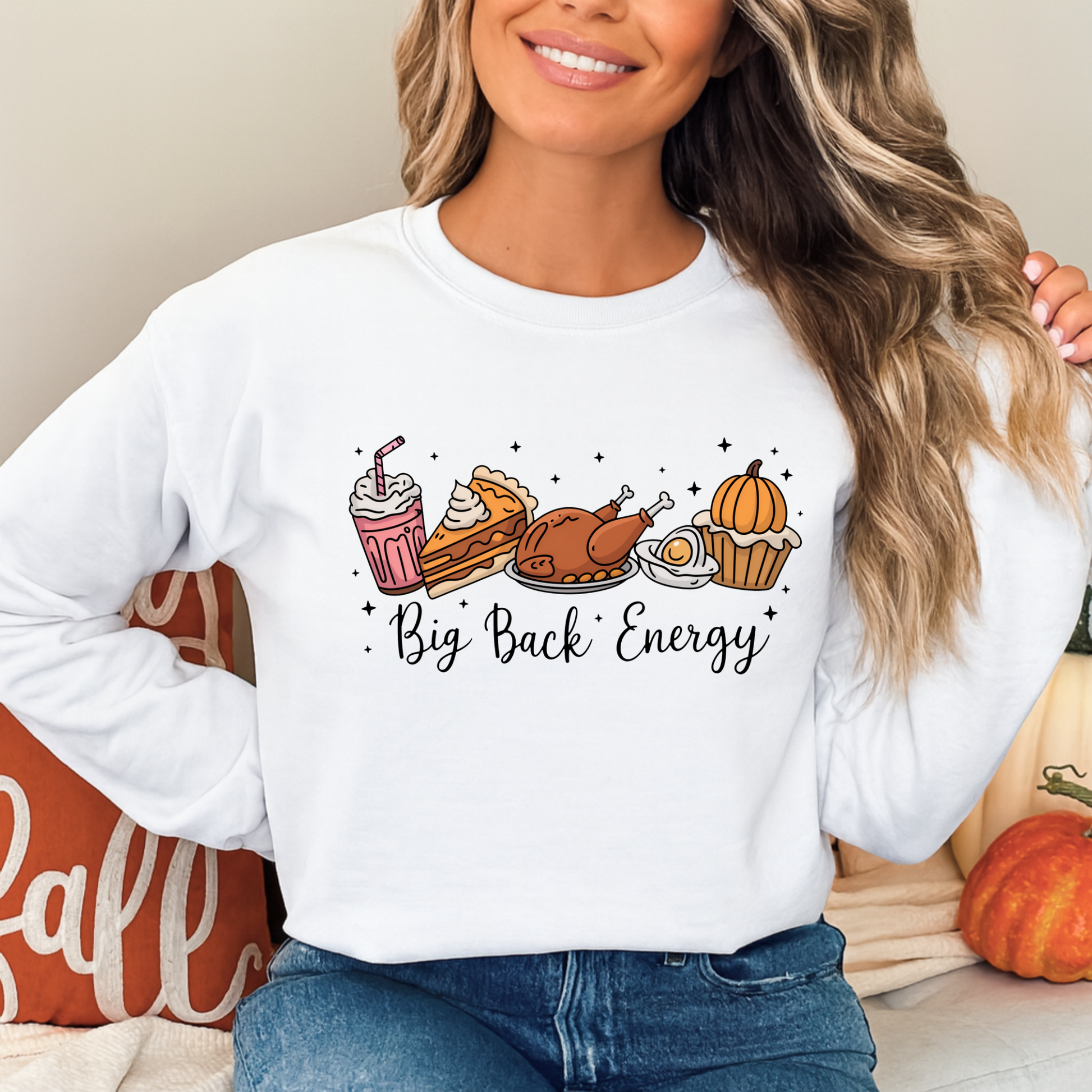 White crewneck sweatshirt styled with fall pumpkins featuring Big Back Energy design