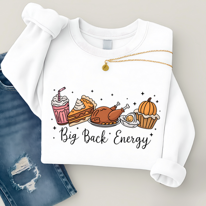 White sweatshirt with food illustrations and 'Big Back Energy' text, paired with blue jeans.