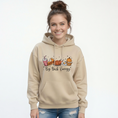 Sand pullover hoodie with a Big Back Energy Thanksgiving food graphic shown on a woman in jeans against a plain white backdrop.