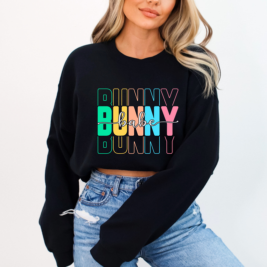 Trendy Bunny Babe sweatshirt with colorful pastel typography, perfect for Easter, spring fashion, and cozy loungewear