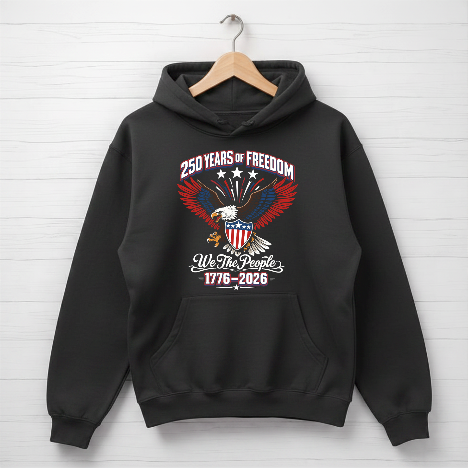 Black America 250 hoodie with an eagle and text design on a white wooden background