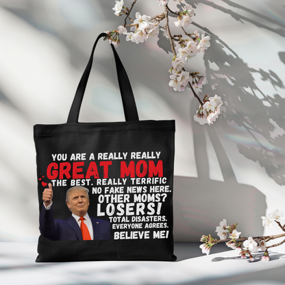 Black tote bag with Trump quote hanging on chair – patriotic gift for her