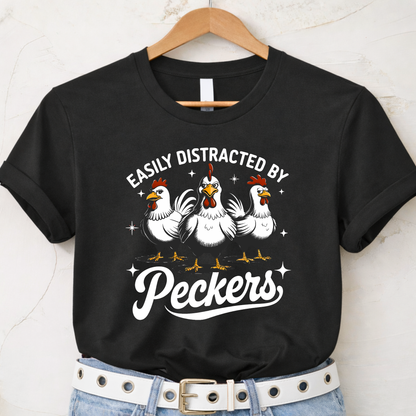 Black t-shirt with chicken graphic and text 'Easily Distracted by Peckers' on a hanger.