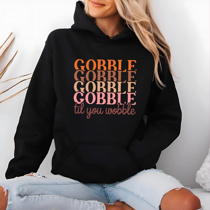 Blonde model in black hoodie with retro Gobble design – cozy Thanksgiving sweatshirt