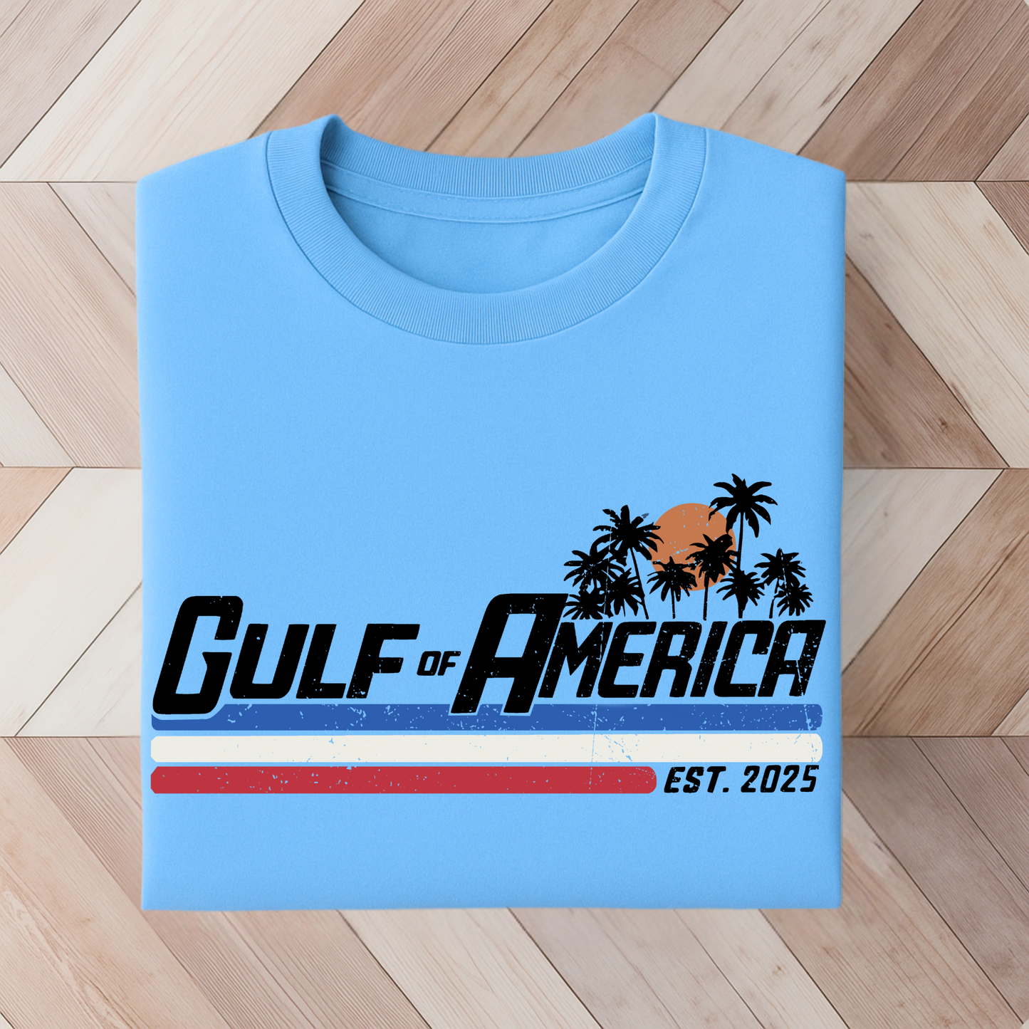 Blue colored patriotic T-shirt with palm tree sunset graphic
