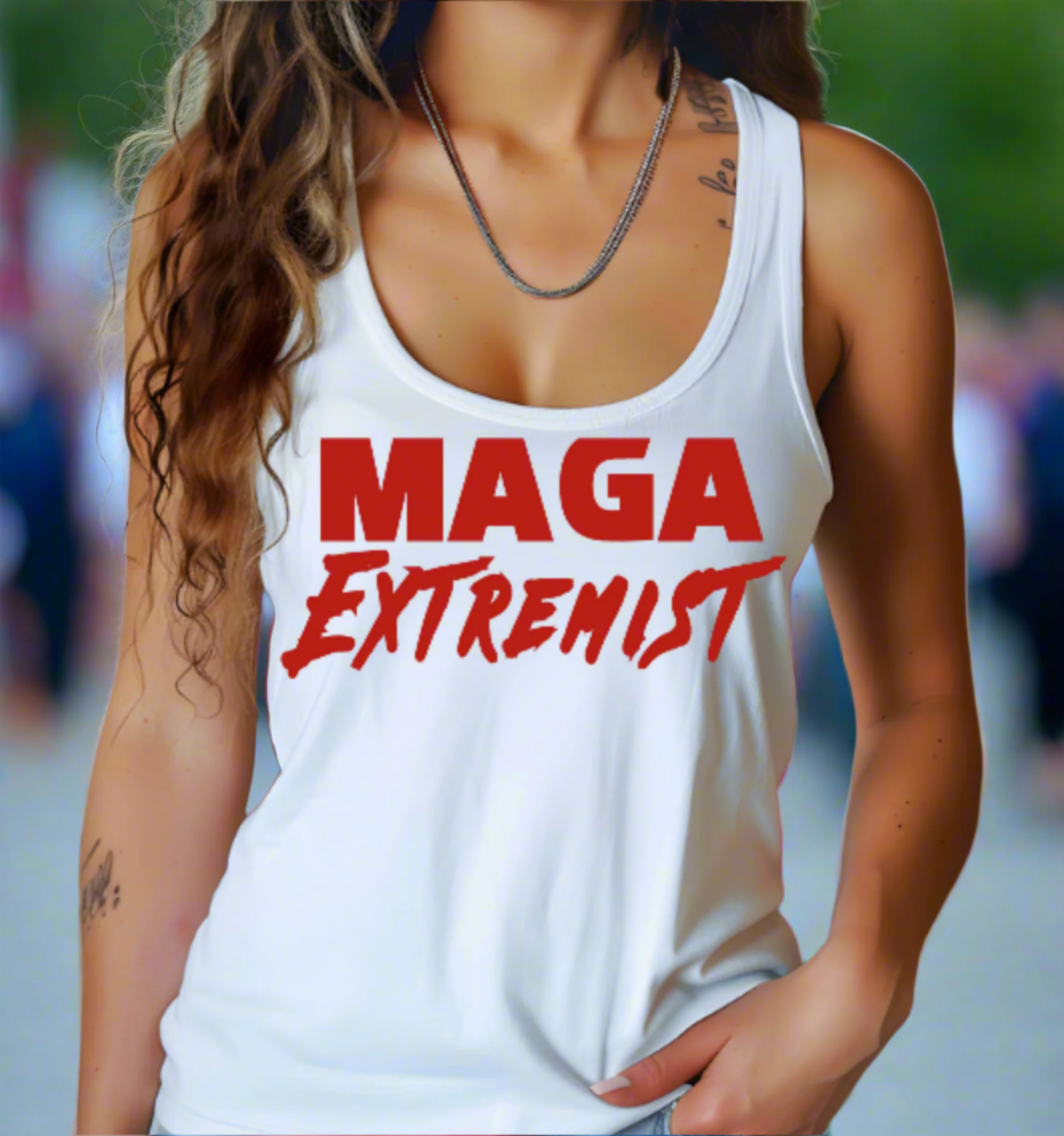 Person wearing a white tank top with 'MAGA Extremist' text, blurred background