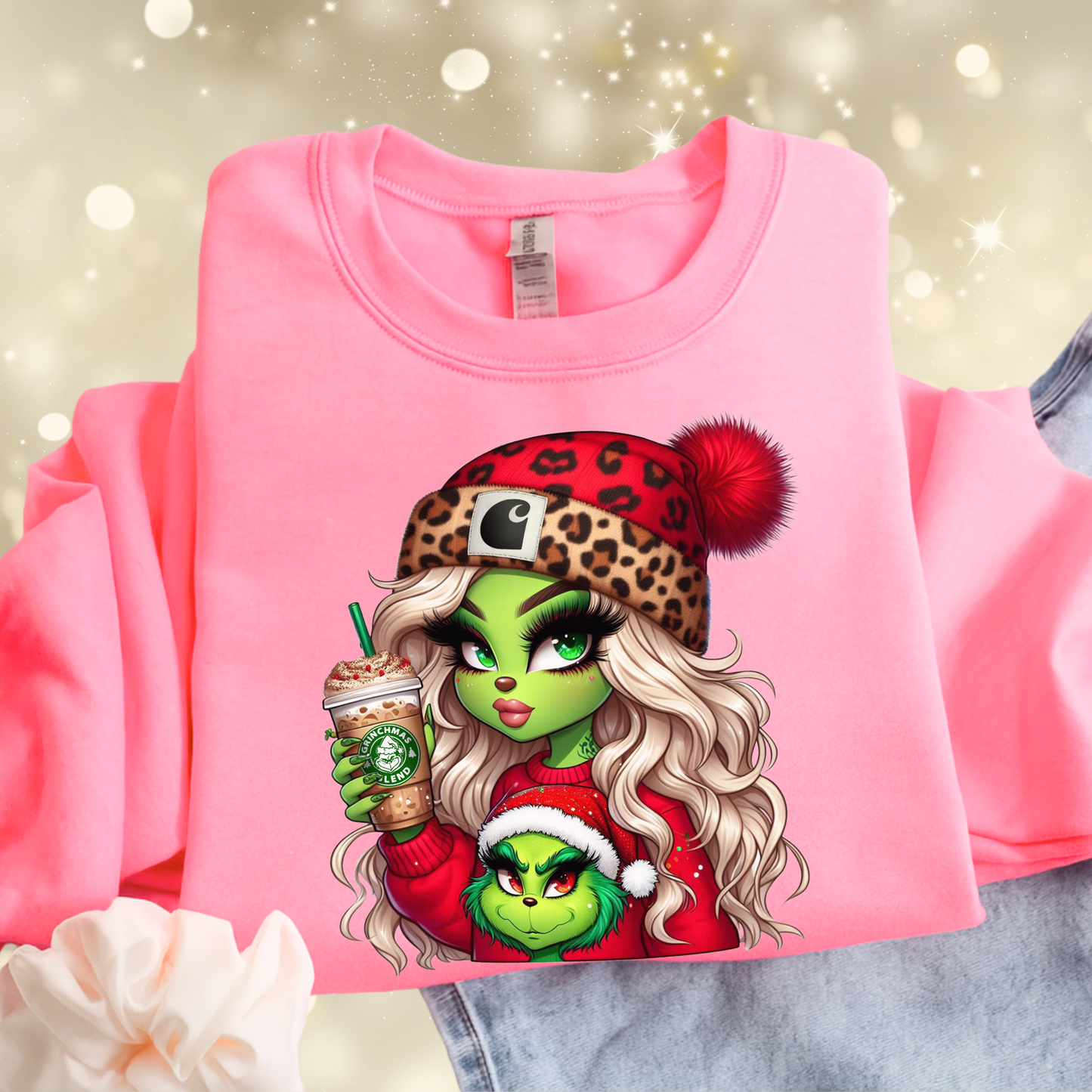 Youth Boujee Green Girl Christmas shirt with a cute festive holiday graphic featuring a green girl in a leopard Santa hat holding a holiday drink. Kids Christmas T-shirt or sweatshirt for girls, available in youth sizes S–XL.