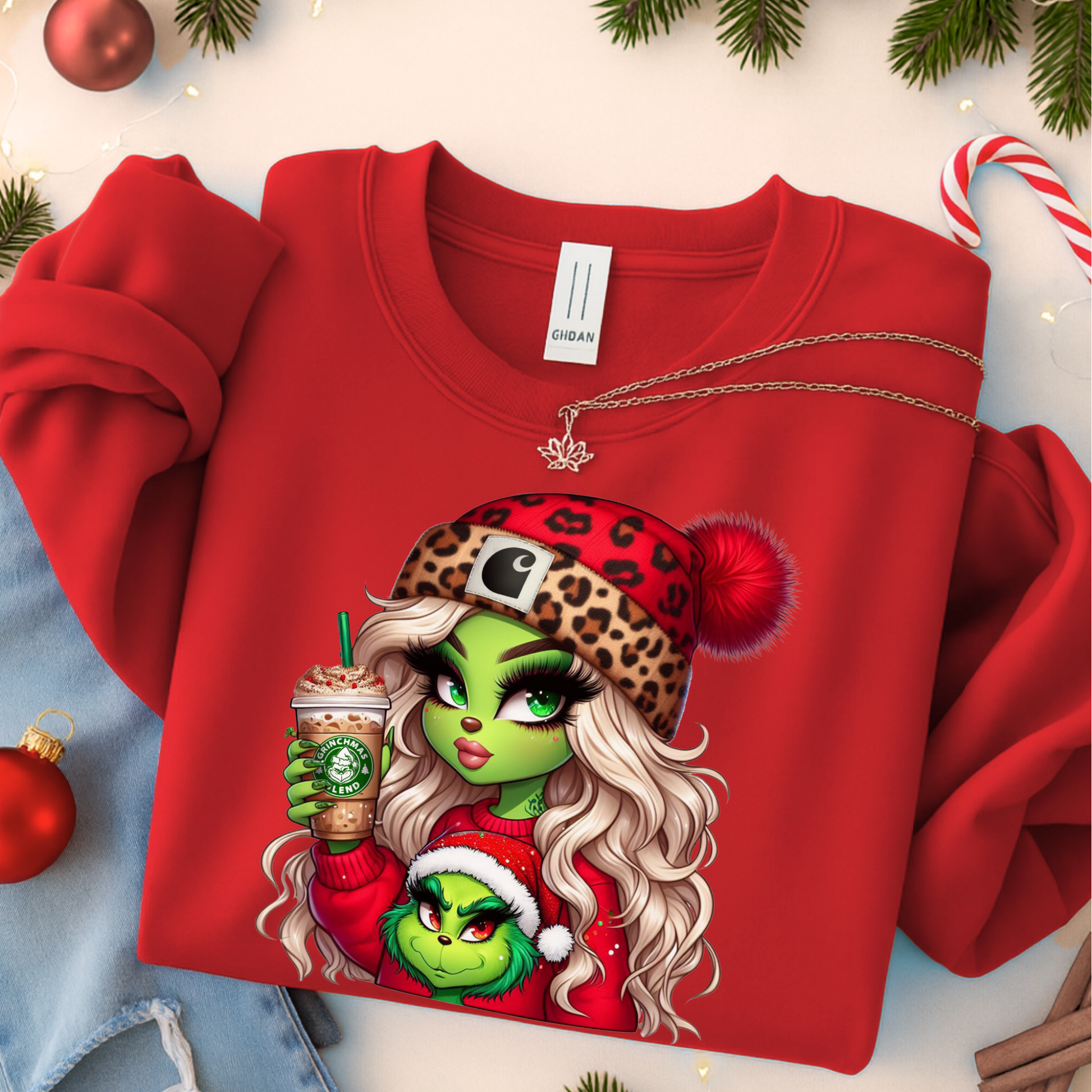Youth Boujee Green Girl Christmas shirt with a cute festive holiday graphic featuring a green girl in a leopard Santa hat holding a holiday drink. Kids Christmas T-shirt or sweatshirt for girls, available in youth sizes S–XL.