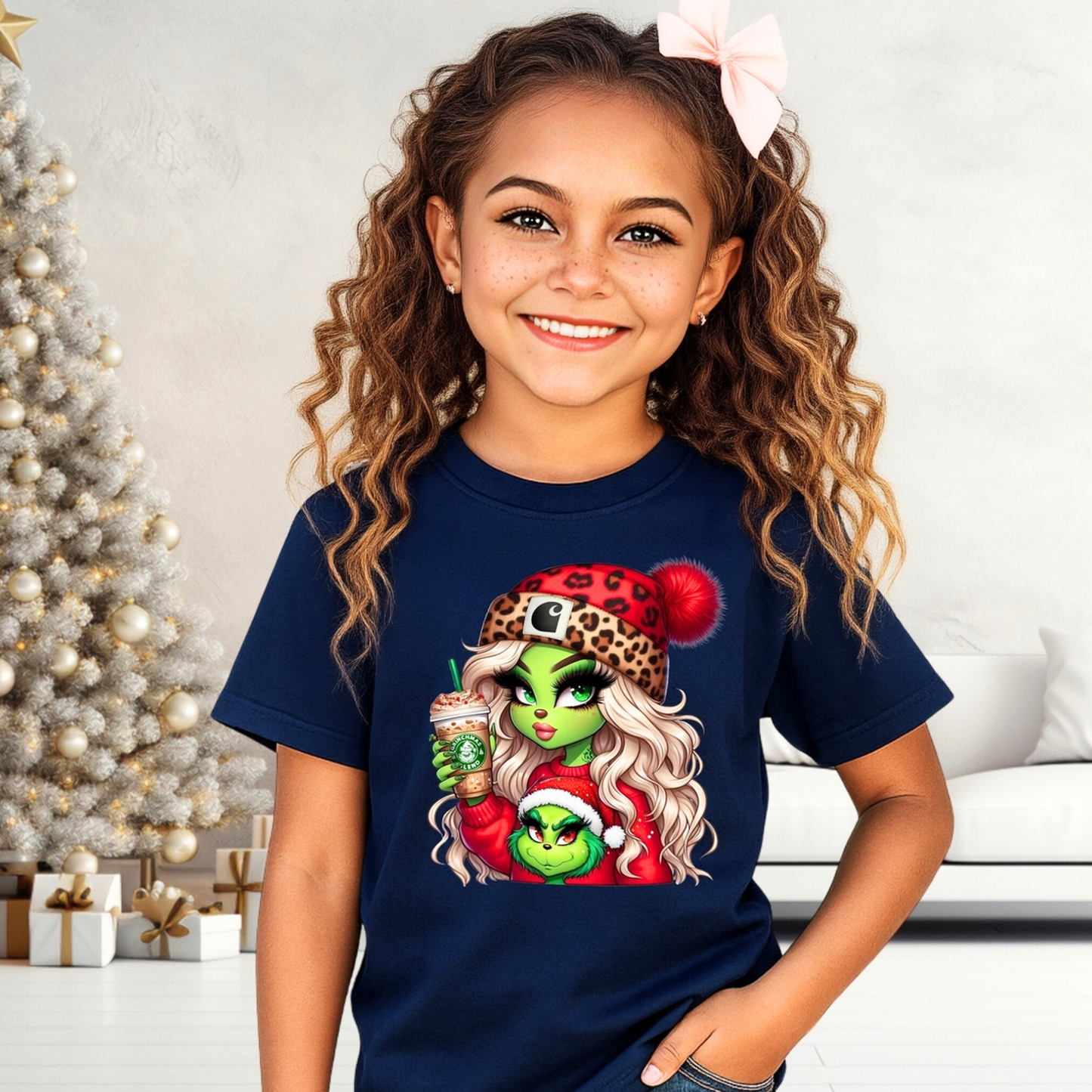 Youth navy Christmas T-shirt with Boujee Green Girl holiday design, worn by a smiling girl with curly hair and a pink bow. Trendy kids Christmas graphic tee.