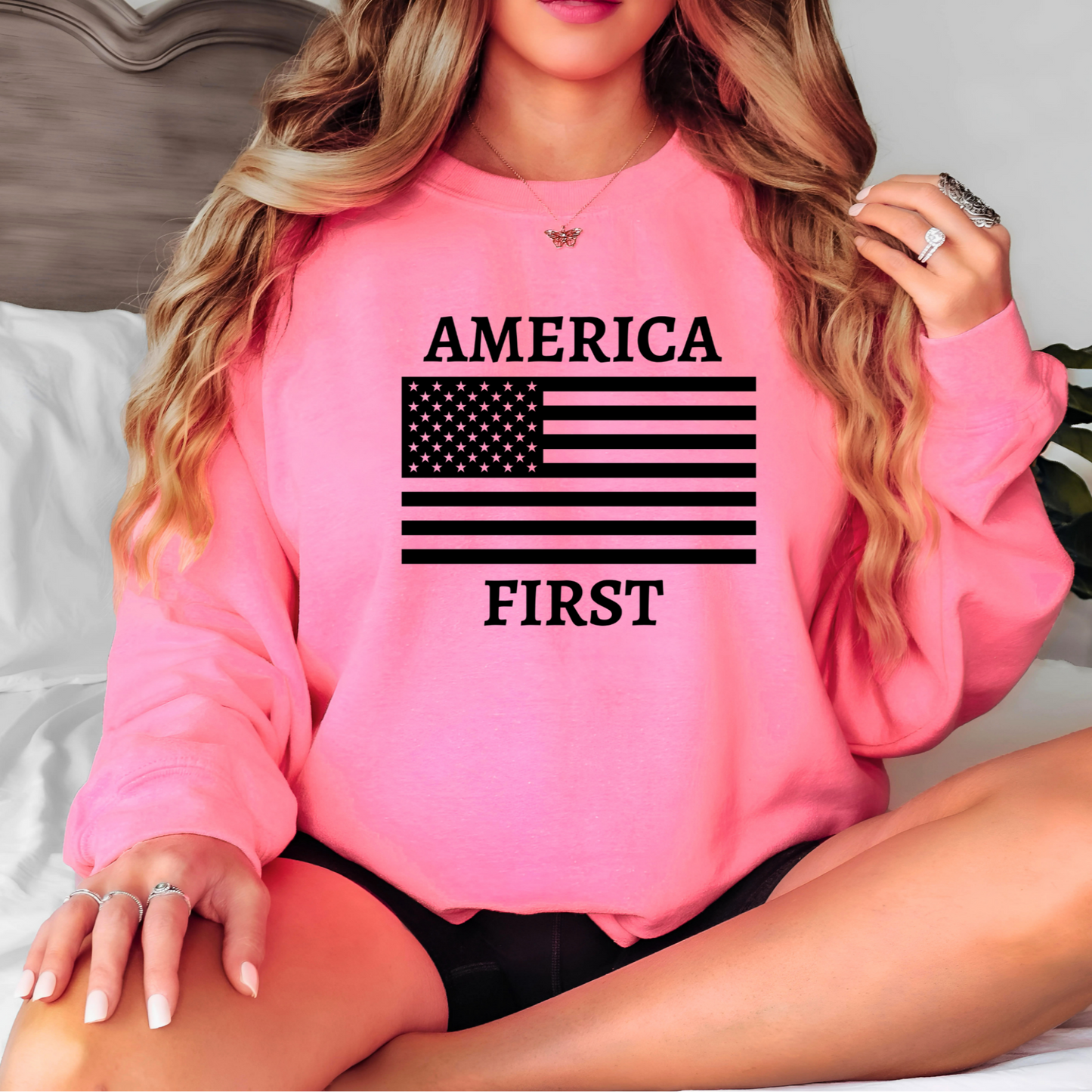 Bright safety pink sweatshirt with white patriotic graphic