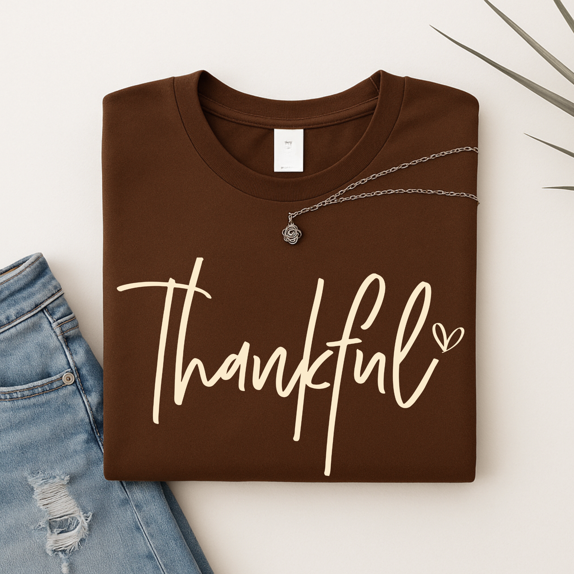 Brown “Thankful” shirt flat lay for fall season