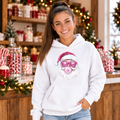 Woman wearing a white Bubblegum Santa hoodie in a rustic Christmas candy shop with peppermint jars and greenery