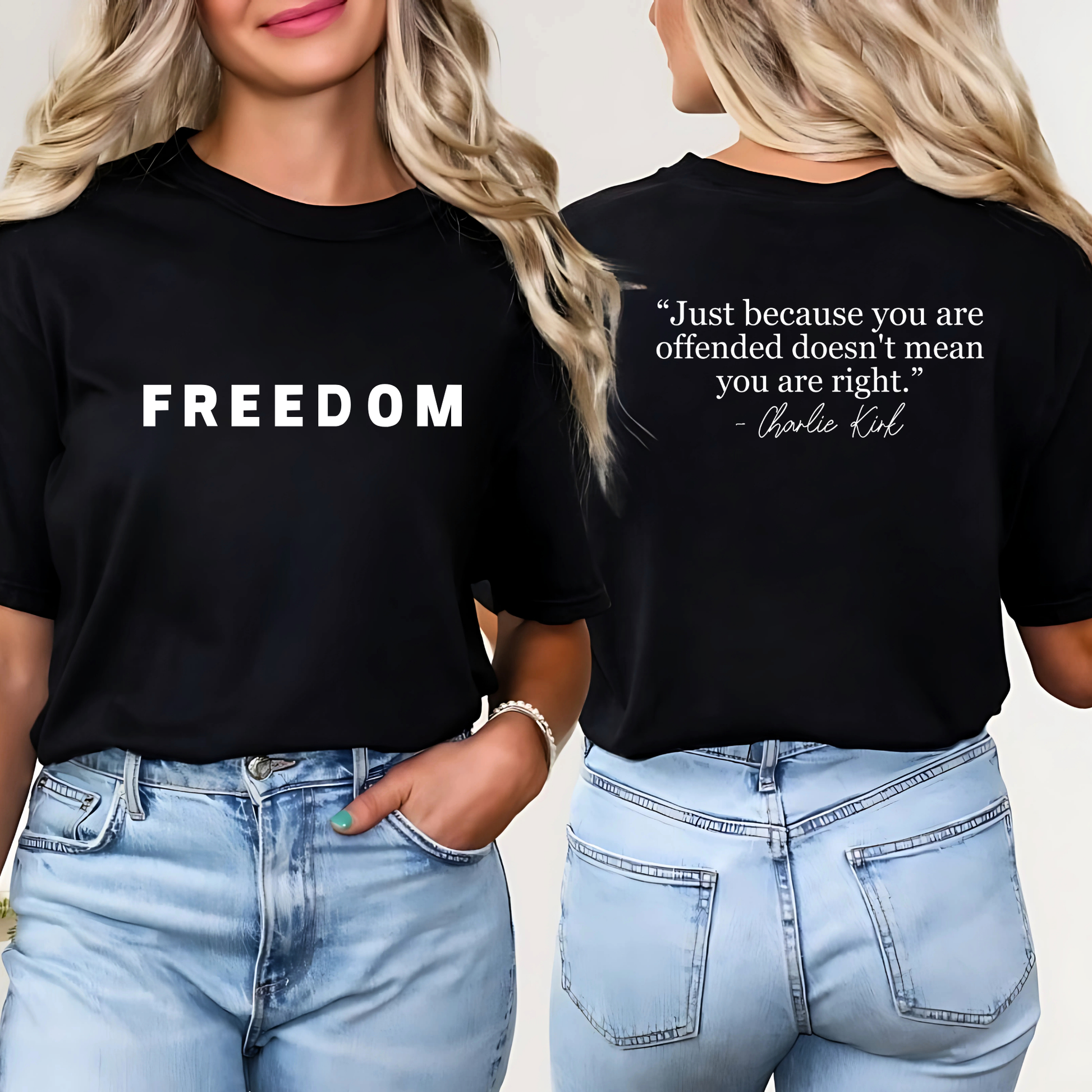 Woman wearing navy FREEDOM t-shirt tucked into jeans