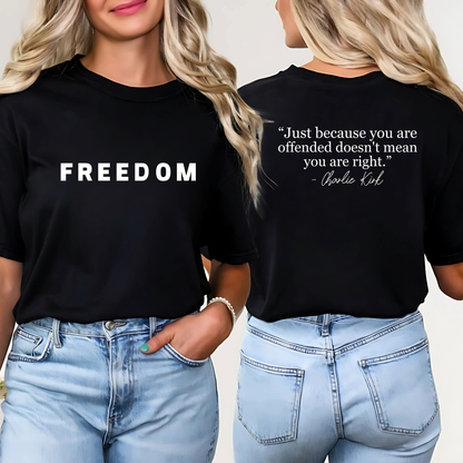 Woman wearing navy FREEDOM t-shirt tucked into jeans