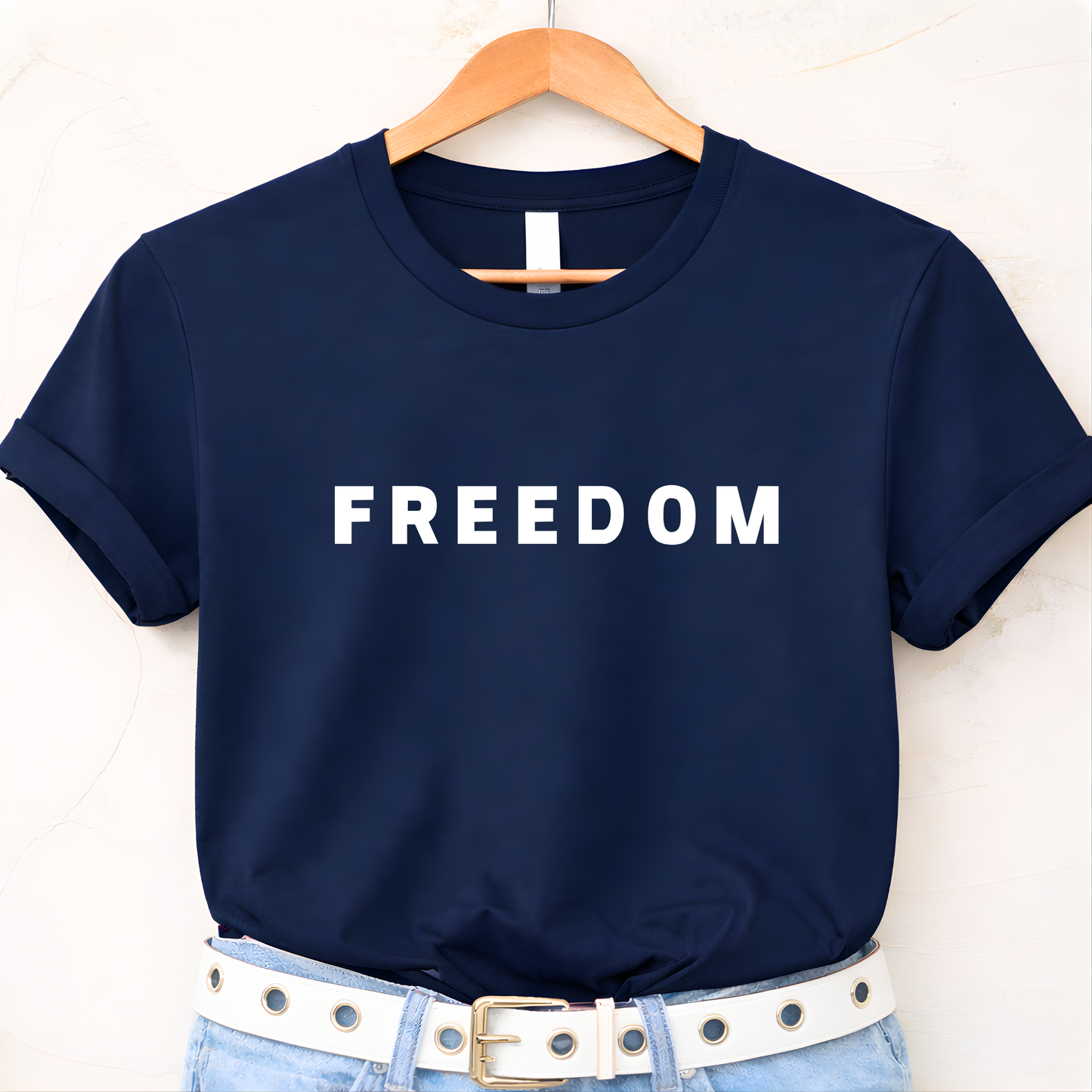 Woman wearing black FREEDOM t-shirt with jeans