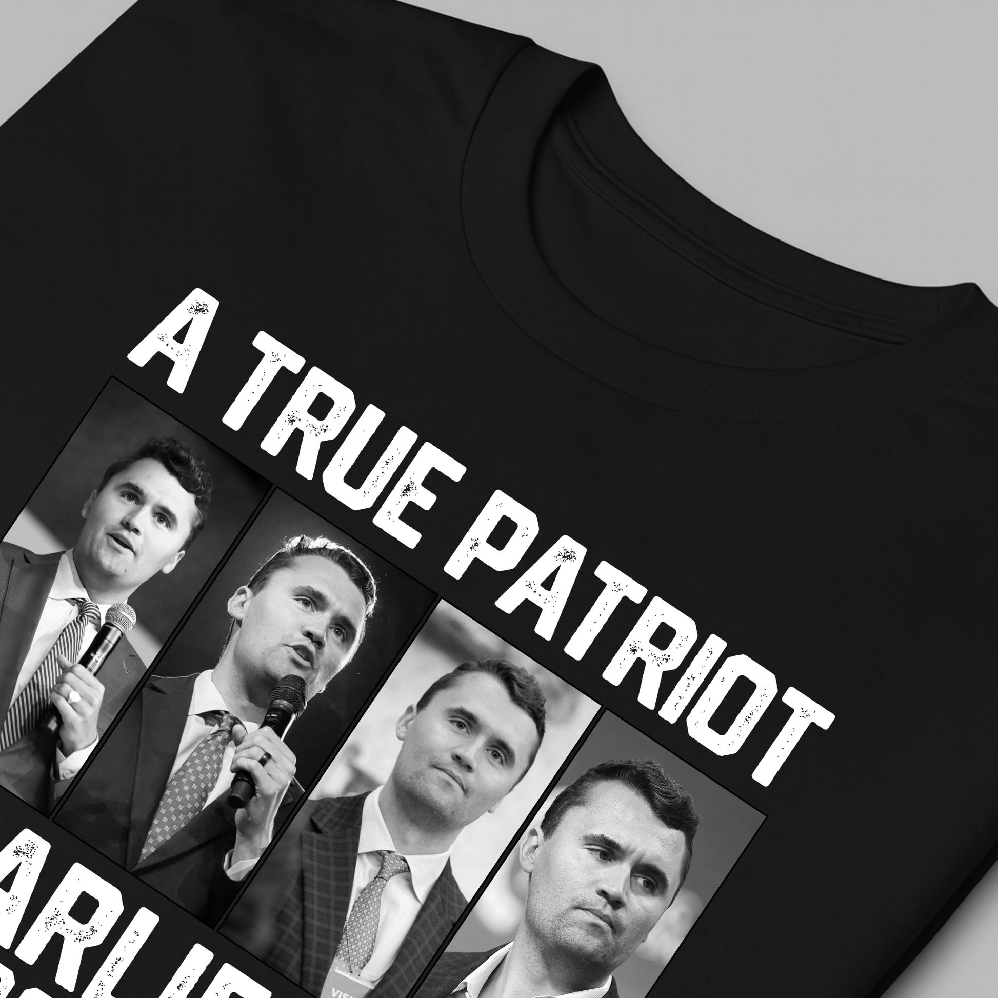Black t-shirt with Charlie Kirk, 'A True Patriot' text and images of a man holding a microphone on a gray background
