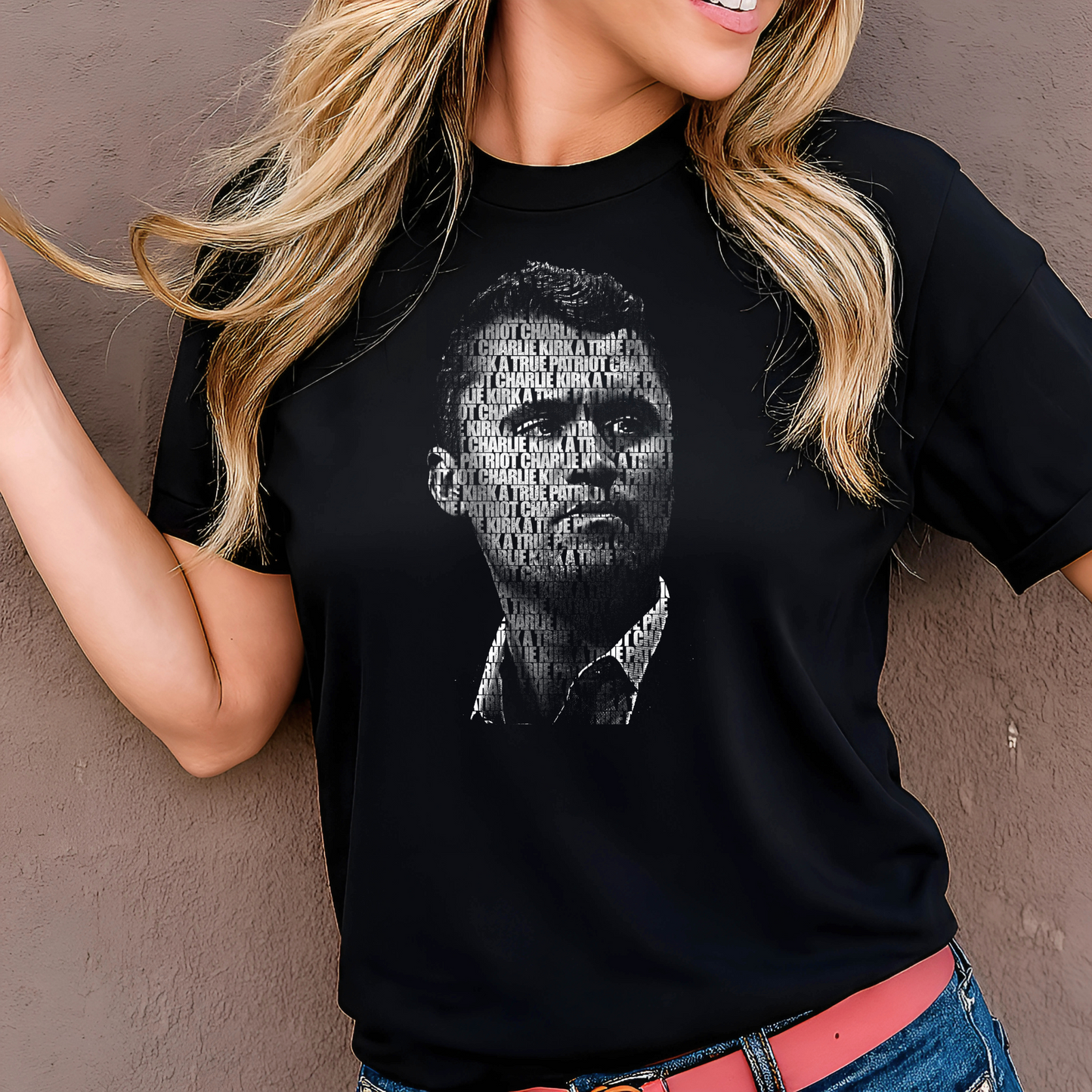 Person wearing a black t-shirt with a graphic design against a plain background