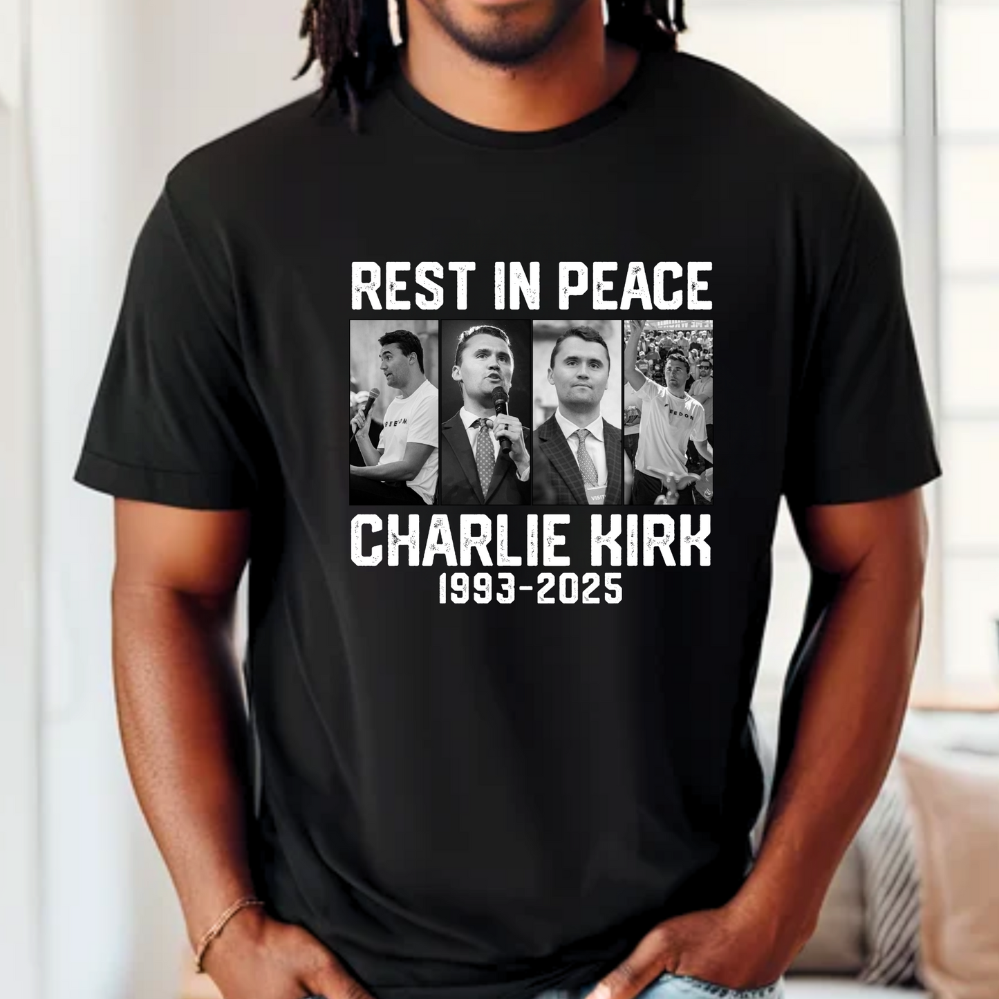 Model wearing black Charlie Kirk memorial shirt with tribute design