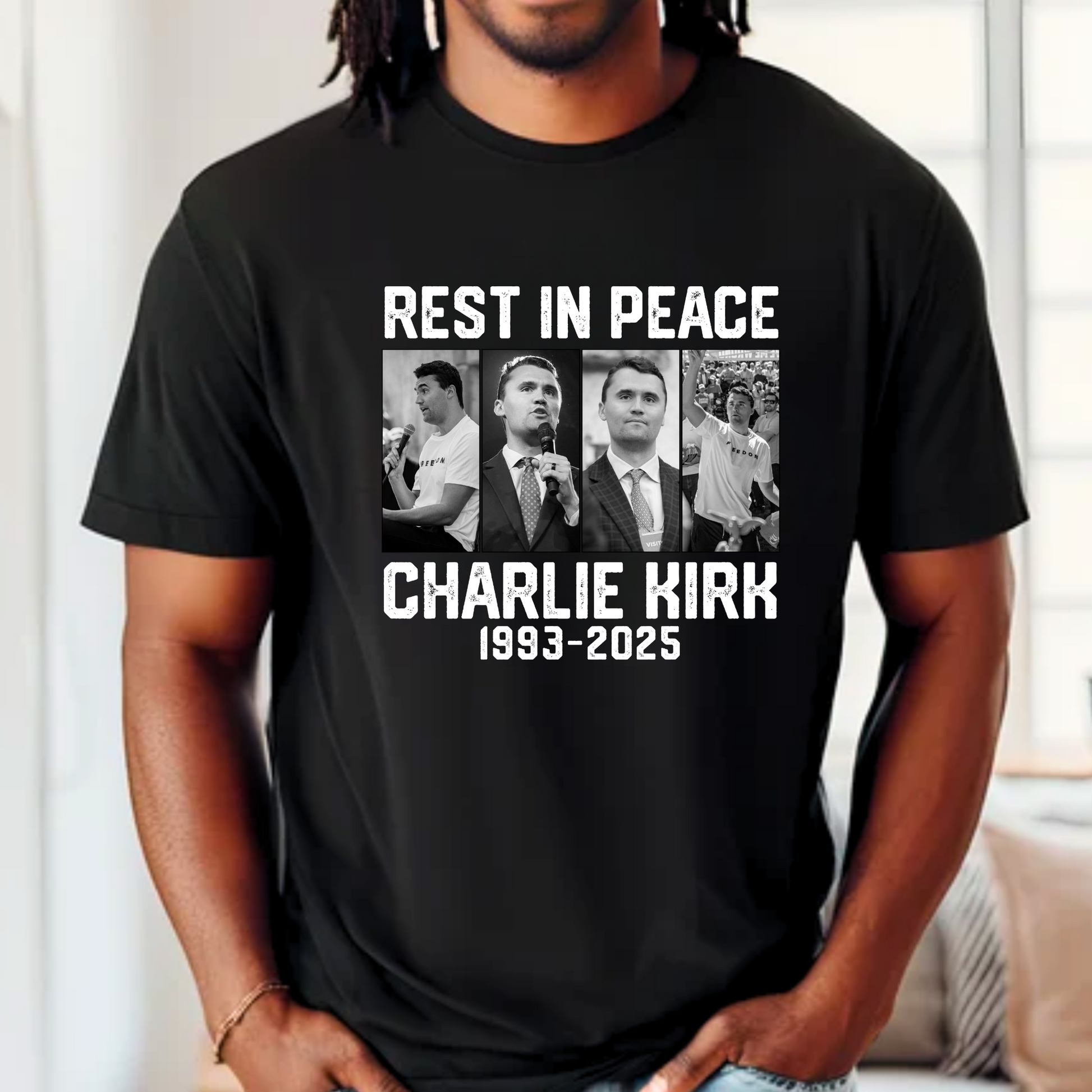 Model wearing black Charlie Kirk memorial shirt with tribute design
