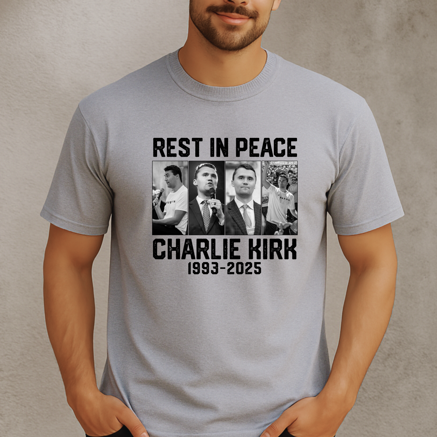 Person wearing a gray t-shirt with 'Rest in Peace Charlie Kirk 1993-2025' design.