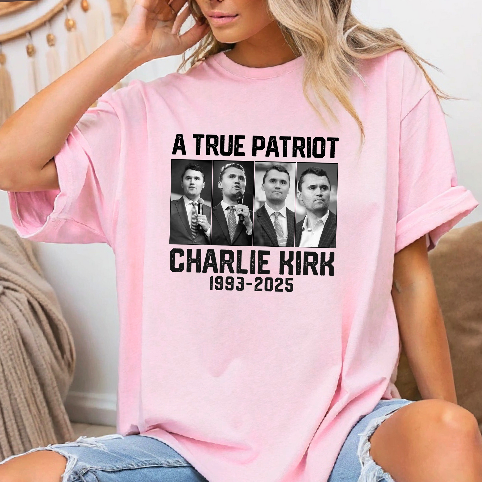 Person wearing a pink t-shirt with 'A True Patriot Charlie Kirk 1993-2025' design.