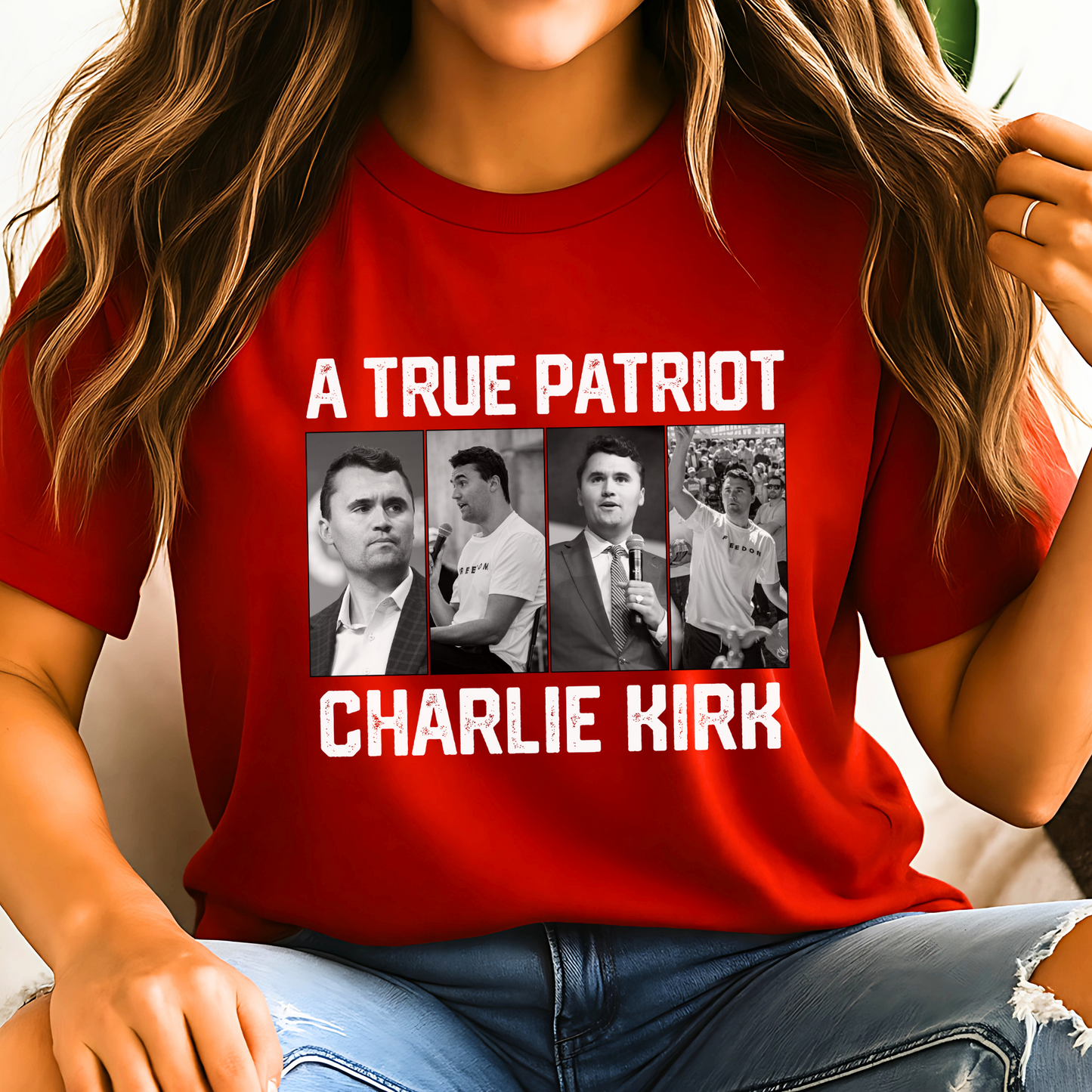 Red t-shirt with 'A True Patriot Charlie Kirk' text and images of a person, worn by a person.